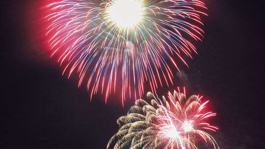 Fireworks blast off from a small raft on Northport Bay for all to see from boats and on land. Enterprise photo by Brian Freiberger