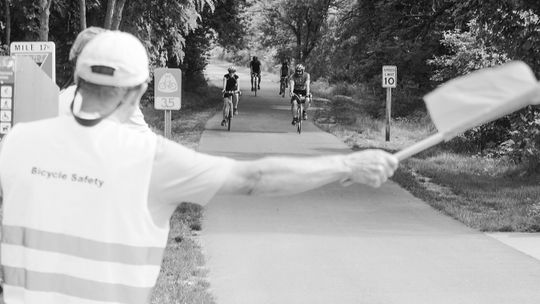 Bicyclist’s cruise into Suttons Bay during the 2023 Tour de Tart. Enterprise photo by Brian Freiberger