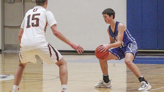 Lake Leelanau St. Mary freshman Josh Bunek dribbles before finding a teammate during a holiday tournament against Ubly to end 2023. Enterprise photos by Brian Freiberger