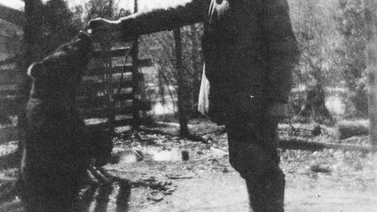 Frank Kratochvil and his pet bear having a beer. Photo courtesy of Elmwood Township a Pictoral History