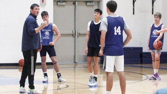 Lake Leelanau St. Mary coach Jim Bunek teaches a ball handling drill at practice earlier this week. Enterprise photo by Brian Freiberger