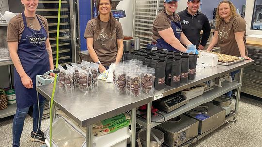 Emily Rosiek, Sarah Conrad, Jessica Hardy, David and Shana Sicotte make chocolate treats at the Great Lake Chocolate &amp; Dessert Co. in Traverse City. Enterprise photo by Brian Freiberger