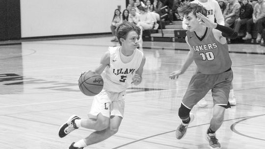 Leland senior Logan DeFour dribbles to the basket during a 65-28 win. Enterprise photo by Brian Freiberger