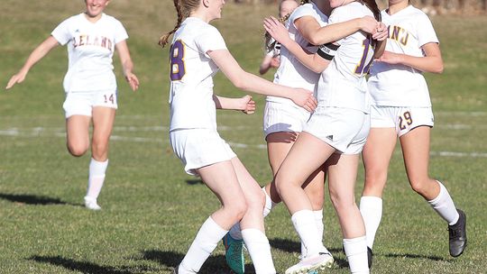 The Leland Comets celebrate after senior Olive Ryder scores with a 30-yard shot. Enterprise photos by Brian Freiberger