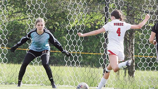 Suttons Bay senior Lauren Lint scores against Leland in the second half of a 3-1 loss against the Comets on Tuesday.