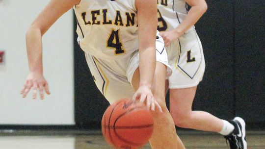 Leland senior Mallory Lowe drives to the basket against Suttons Bay last Thursday during a 51-9 win. Enterprise photo by Brian Freiberger