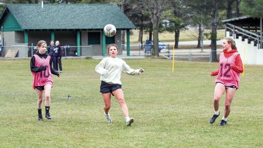 A trio of Leland Comets battle for possession during a drill at spring practice Monday. Enterprise photo by Brian Freiberger