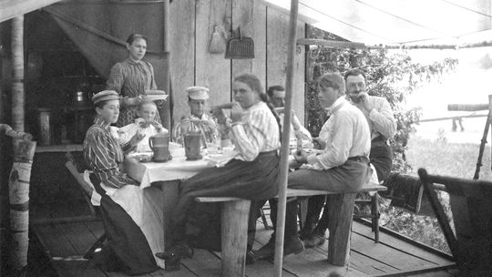 It took a while for sweet corn to become an American summer standard. This picture is of a family enjoying corn during a visit to North Lake Leelanau. Photo courtesy of the Leelanau Historical Society