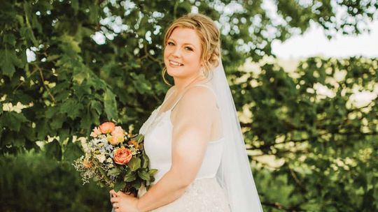 Designer, store owner, makes own wedding gown