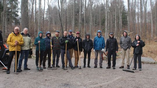 Several volunteers brave the rain on Tuesday to clean up Palmer Woods Trail in one of several events celebrating Earth Week across Leelanau County. Enterprise photo by Brian Freiberger