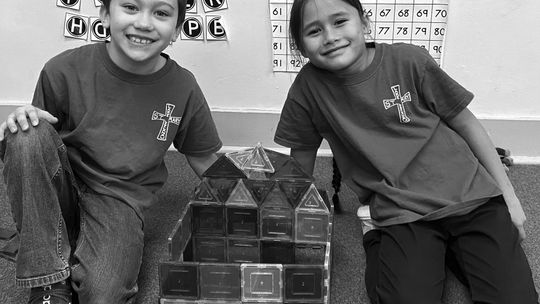 During the school year, St. Mary students and staff celebrate Faith First Friday, the first Friday of each month. January 5. The first Friday of the new year, students and staff wore Faith First Friday T- shirts to show their commitment to the Catholic faith. Pictured from left are first g...