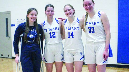 Lake Leelanau St. Mary girls basketball seniors from left to right: Sarah Bunek, Della Bunek, Delana Kirt, and Leah Fleis. Enterprise photo by Brian Freiberger