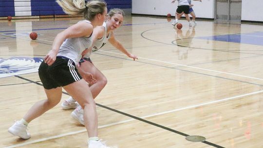 St. Mary senior Cathryn Mikowski and Kyla Barnowski battle for possession during a practice drill last week. Enterprise photo by Brian Freiberger