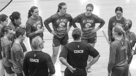 Lake Leelanau St. Mary girls basketball discusses the game plan before playing Suttons Bay earlier this season. The Eagles are off to the best start in recent memory with a 5-1 record. Enterprise photo by Brian Freiberger