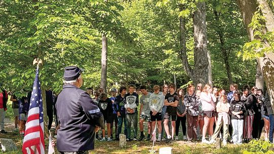 Eighth grade students from Glen Lake School were part of a cemetery Friday honoring those whose final resting place is a historical, long-lost ceremony in Glen Arbor Township. Enterprise photo by Everett Howell