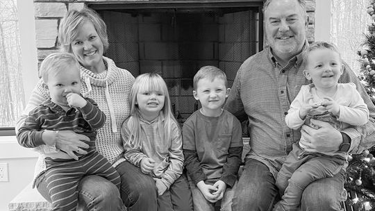 Tim Hurley (right) poses for a holiday photo with his wife, Anne, and four grandchildren. Recently, Tim and Anne welcomed their fifth grandchild into the world. Courtesy photo
