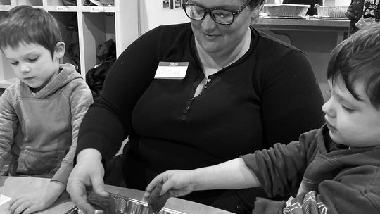 A Leelanau County family is pictured together during an activity in a previous Parenting Communties’ Families Together session. Courtesy photo