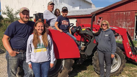 The Noonans draw close at harvest time when family members pitch in to get a variety of crops in. From left are Casey and wife Becca, patriarch Roger, Ivy, 6, Owen, 10, and Roger’s wife, Beth. Not pictured is 2-year-old Claire, who developed a temporary case of camera shyness. Enterprise p...