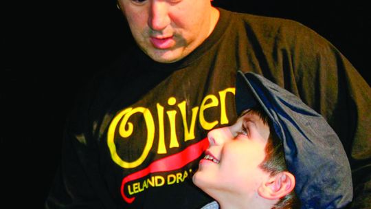 Jeremy Evans is pictured with Lukey Klein during the theater production of “Oliver” at Leland Public School in 2010. Photo courtesy of Jeremy Evans