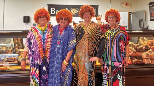 Friends and co-workers at Hansen Foods dressed up like Mrs. Roper from the 1970s sitcom “Threes Company.” Enterprise photo by Amy Hubbell
