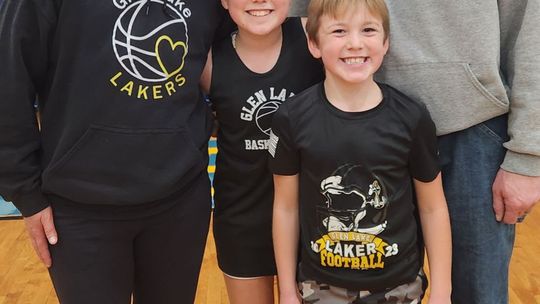 Therese Rosinski is pictured with her husband, Greg, and daughter, Alex, 12 and son, Drew, 9 at Glen Lake Community School.  Courtesy photo