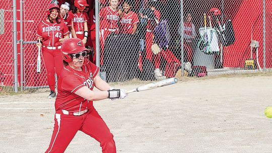 Suttons Bay senior Minnie Bardenhagen makes contact during her first softball game against Lake Leelanau St. Mary on Tuesday. Enterprise photo by Brian Freiberger