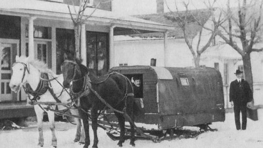 The Northport Mail Stage in front of the Porter House Hotel, circa 1891. In the winter, sled runners replaced the wheels; the covered top, locally called “caboose,” sheltered the driver and passengers . (Lap robes were provided.) Courtesy photo
