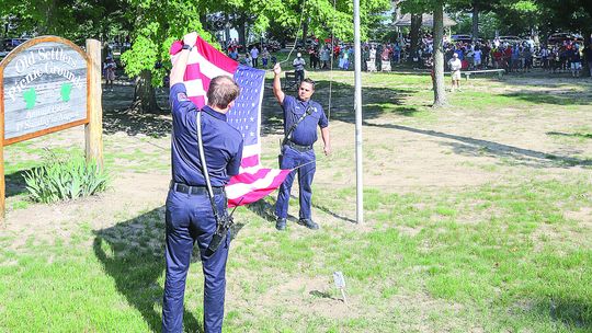 GL Women’s Club host flag raising for 57th year