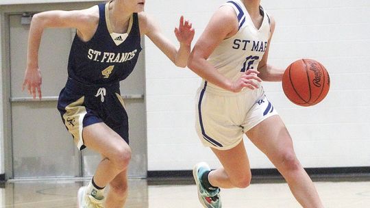 Eagle senior Della Bunek pushes the ball up the court against the Gladiators. St. Mary took care of business for the Eagles first win over the Gladiators since 2007.