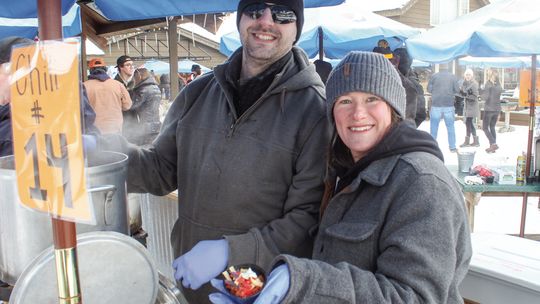 Glen Lake Community Schools food service professionals Jonathon Fields and Mindy Hawley won the 25th annual Winterfest chili cook off hosted by Boonedocks in Glen Arbor on Saturday. Over 800 people attended the event this year. Enterprise photo by Brian Freiberger