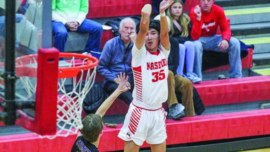 Suttons Bay guard Urijah TwoCrow attempts a 3-pointer against Leland in a 75-54 win Friday. Enterprise photo by Brian Freiberger