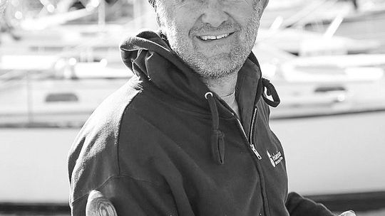Ben Hale, captain of the Inland Seas Education Association schooner bearing the organization’s name, stands on the deck of his tall ship. Hale was recently honored as “sail trainer of the year” 2023 by Tall Ships America. Courtesy photo
