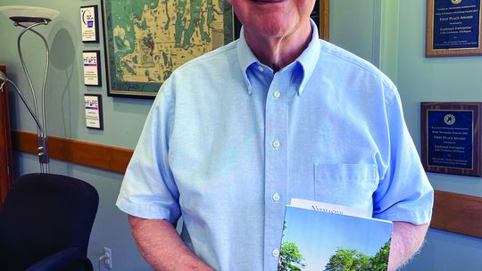Haywood Draper of Lake Leelanau has penned a history of ‘The Colony’ on South Lake Leelanau. Enterprise photo by Brian Frieberger