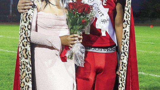 Suttons Bay senior Austin Vang and Michelle Arroyo were named king and queen during a homecoming football game Friday.
