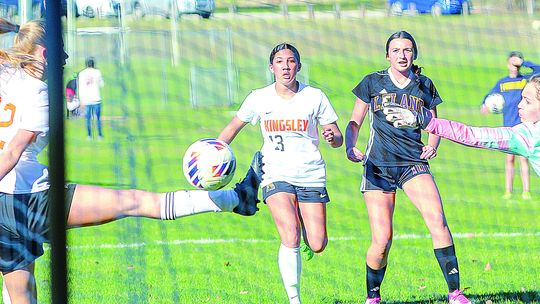 Leland freshman Lillian Connor barely misses the net in a 7-3 win over Kingsley on Monday. Enterprise photo by Brian Freiberger