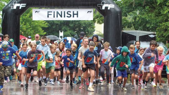 Hundreds of kids braved the rain at the 17th annual Running Bear Run in Glen Arbor on Tuesday. The race is sponsored by the Glen Arbor Women’s Club and 90% of the proceeds from our race provide scholarships for Glen Lake School seniors, with the remainder going toward other community chari...