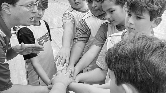 Trevor Bunek, who coaches 5th graders at Suttons Bay Public School, is seen at a recent practice with students that will participate in the upcoming inaugural Strongheart Boys Invitational. Photo courtesy of Joseph Symons