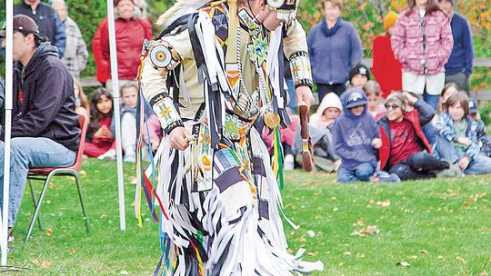 A tribal dancer is pictured at the beginning of Indigenous Peoples’ Day activities held at the Leland Cultural Campus on Monday. There were well over 100 people on the lawn, including students from Leland Public School. Photo courtesy of Mark Morton