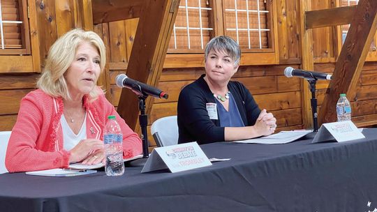 Lisa Trombley and Betsy Coffia, from left, shared their views on issues at Tuesday’s Cherry Pie Debate. Enterprise photo by Meakalia Previch-Liu