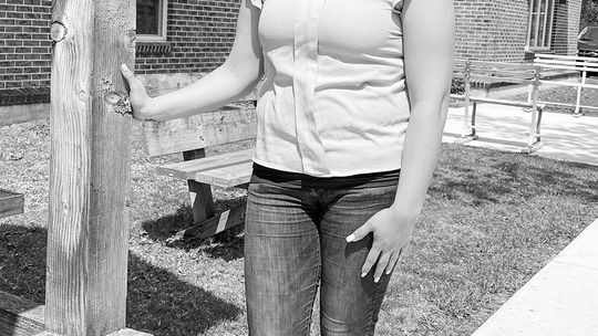 Jessica Wilson, who currently serves as the Leelanau Township clerk, is pictured in front the township hall on Monday afternoon. Enterprise photo by Meakalia Previch-Liu