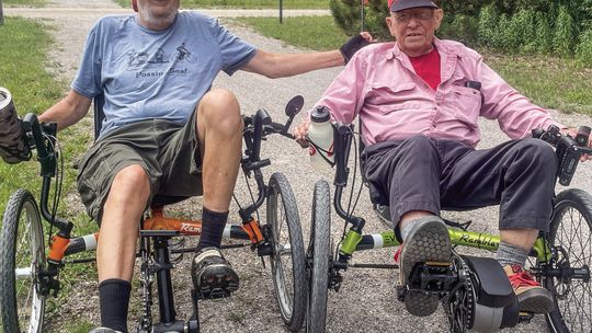 Jim Hirtreiter and Bob Resh spent their Sunday cruising down Sleeping Bear Heritage Trail on their recumbent bicycles. See story on page 2. Enterprise photo by Brian Freiberger