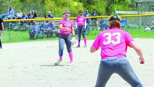 St. Mary junior Cathryn Mikowski handles a ground ball and delivers a strike to first baseman Leah Fleis during the Kris Popp tournament Saturday.