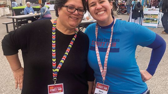 Co-chairs Patrice Korson, left, and Mary Lingaur had instrumental parts in the continuation of the Lake Leelanau Street Fair, which is estimated to have brought up to 2,000 people to the community. Enterprise photo by Alan Campbell