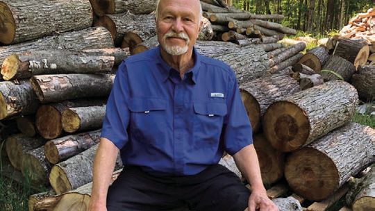 Jeff LaCross, who is long retired but continues to chop and sell firewood, hopes to enlighten those attending the county Memorial Day ceremony with knowledge of the sacrifices made by Vietnam veterans. Enterprise photo by Alan Campbell