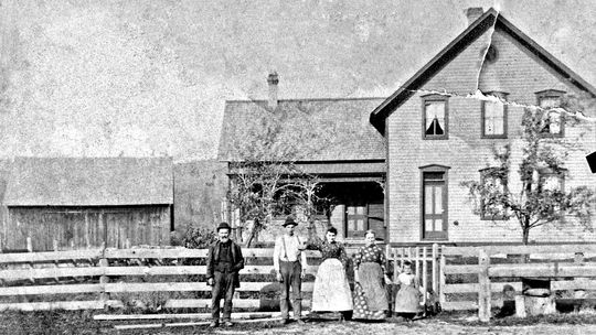 Portrait of Julius Prause (senior) (on the left) with unknown family members, in front of their home, now known as the Goffar Farm, c 1900. Photo Source: Preserve Historic Sleeping Bear Online Archive