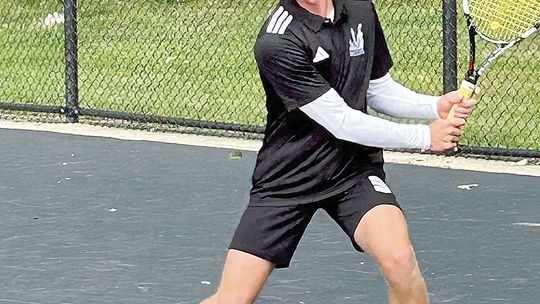 Glen Lake senior Michael Houtteman setting up for a topspin backhand against Grand Haven. Courtesy photos