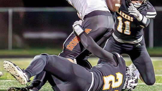 The swarming Glen Lake defense forced a fumble during a 38-14 win over Mancelona in the first round of the MHSAA football playoffs. Sam Dykstra (right) and Peter Gelsinger (left) Photo courtesy of Meridith McNabb