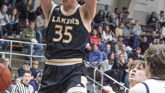 Glen Lake sophomore Jacob Plamondon throws down a dunk against TC St. Francis during the Northern Michigan Basketball Showcase on Saturday. The Lakers defeated the Gladiators 55-42. Enterprise photo by Brian Freiberger