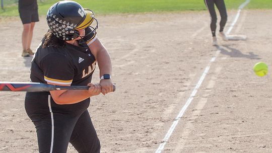 Glen Lake senior Ella Flores smashes a single against TC Christian earlier this month. Enterprise photo by Brian Freiberger