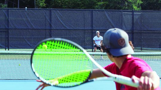 Glen Lake sophomore Hathorne Sutherland volleys a serve from junior Ben Selby at practice earlier this week. Enterprise photo by Brian Freiberger